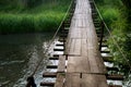 Old suspension bridge in an old mountain village Royalty Free Stock Photo