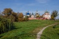 Old Sviato-Troitskyi Monastery on a background of autumn trees