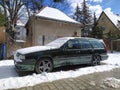 Old classic veteran Swedish hatchback car Volvo 850 parked in snow in Gdansk, March 12th, 2023.