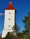 Old swedish lighthouse with red roof with blue sky as background. Built in 1777