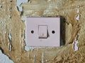 Old switch on the peeling wall Royalty Free Stock Photo