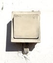 Old switch on a white wall. Close-up Royalty Free Stock Photo
