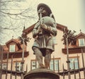 Old symbol in sculpture of shepherd with a pipe in center of Bavarian city