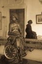 Old table clock with golden statue of a female figure.