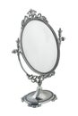 Old table mirror in a beautiful silver frame. Royalty Free Stock Photo