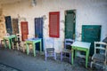Old tables and seats on street. Royalty Free Stock Photo
