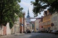 Old Tallinn street with a view of the Niguliste church. Medieval houses and cobblestone pavement Royalty Free Stock Photo