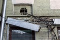 Old tangled wires - electrical, telephone, antenna, computer, network on the wall of a dilapidated house with separate wires in me Royalty Free Stock Photo