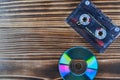 Old tape and disk recording on a wooden table Royalty Free Stock Photo