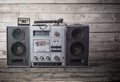 the old tape recorder and cassette on wooden background Royalty Free Stock Photo