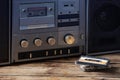 the old tape recorder and cassette on wooden table Royalty Free Stock Photo