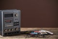 the old tape recorder and cassette on wooden table Royalty Free Stock Photo