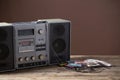 the old tape recorder and cassette on wooden table Royalty Free Stock Photo