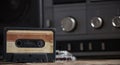 Old tape recorder and cassette on  wooden table Royalty Free Stock Photo