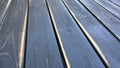 Old teble top. Texture of old wooden shabby planks with cracks and stains. Abstract background of wooden floor