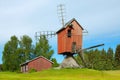 Old technology, finnish windmill on a green meadow Royalty Free Stock Photo