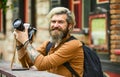 Old technology. Journalist reporter. Professional photographer use vintage camera. Photography business. Bearded man Royalty Free Stock Photo