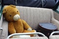 Old teddy bear and  suitcase in the car Royalty Free Stock Photo