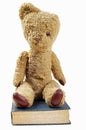 Old teddy bear and old book Royalty Free Stock Photo