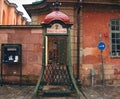 old telephone booth under the snow in Gamla Stan district. Stockholm