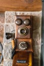 Old Telephone with hand crank on brick wall in palma, mallorca, spain Royalty Free Stock Photo