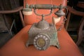 Old telephone retro rotary phone antique style in vintage room Royalty Free Stock Photo