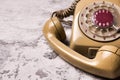 An old telephone with rotary dial on grunge background Royalty Free Stock Photo