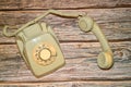old telephone unhooked on a wooden table Royalty Free Stock Photo