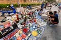 Old televisions and other junk for sale at a street flea market