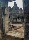 Old temple as seen through a window of another temple at Angkor Wat, Siem Reap, Cambodia Royalty Free Stock Photo