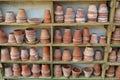 old terracotta flower pots on the shelf of a potting shed Royalty Free Stock Photo