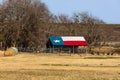 Old Texas barn with Texas flag painted on the roof