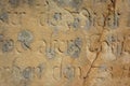 Old text engaved in sandstone