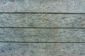 Old textured discoloured wooden boards arranged horizontally