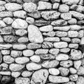 Old textured stone wall, black and white image Royalty Free Stock Photo