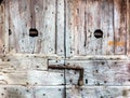 Old Textured Weathered Wooden Door with Padlock. Grunge and Rough Surface for Design Purpose Royalty Free Stock Photo
