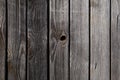 Old textured wood surface with flaws nail, resin, knot. Natural background of dark larch boards Royalty Free Stock Photo