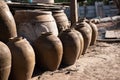 Old Thai traditional clay jars on outdoors ground. Group of Thai dragon classical antique pattern vase in Ratchaburi province of Royalty Free Stock Photo