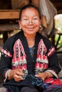 Old Thai woman with large earings