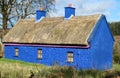 Old thatched blue cottage in rural setting, County Sligo, Ireland Royalty Free Stock Photo