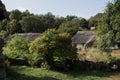 Old thatched cottage in the forest Royalty Free Stock Photo