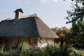 Old thatched cottage in the forest Royalty Free Stock Photo