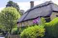 Flying Union Jack in a garden of country house in an english countryside Royalty Free Stock Photo