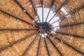 The old thatched roof leaked holes and was damaged by the storm..View of natural thatched roof with hole. The ceiling of old Royalty Free Stock Photo