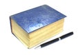 Old thick book blue cover and pen on white background Royalty Free Stock Photo