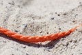 Old thick nautical rope on the sand ground . Royalty Free Stock Photo