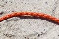 Old thick nautical rope on the sand ground . Royalty Free Stock Photo