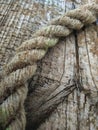 Old thick rope on a pine Board gray Royalty Free Stock Photo