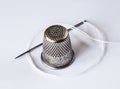 Old Thimble and a Needle Royalty Free Stock Photo