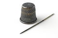 Old thimble and rusty sewing needle isolated on white background Royalty Free Stock Photo